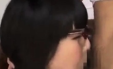 Asian bimbo sucks on a big cock close up